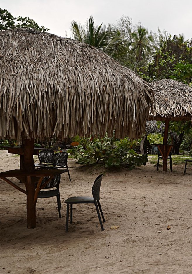 Tables on the beach at Coco Beach Moorea.