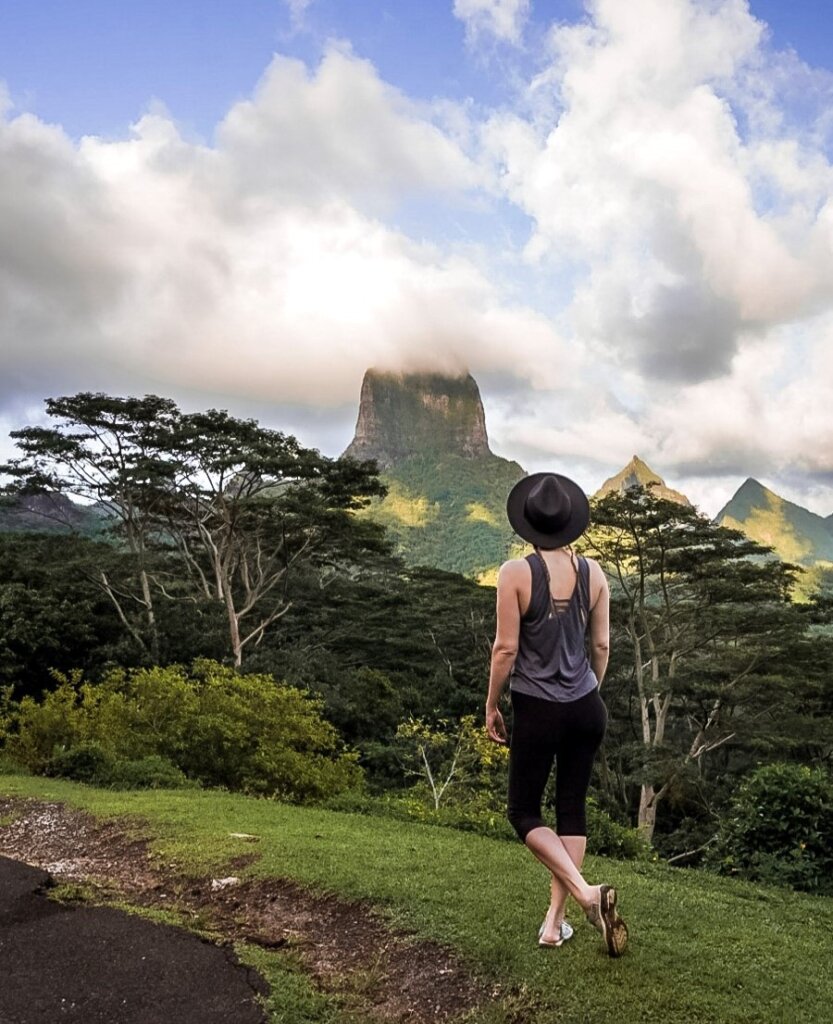 Monica looking out over the mountainous view, seen on many Moorea hiking trails.