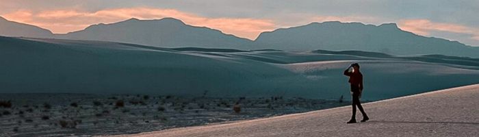 Monica in White Sands National Park at sunset -  a USA Travel Guide.