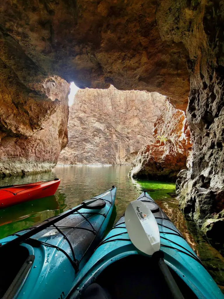 The bright green Emerald Cave with kayaks, one of the best Arizona Bucket List Things To Do.