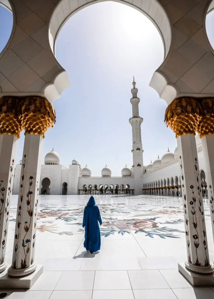 Monica in an Abu Dhabi mosque, after a 15+ hour Long Haul Flight.