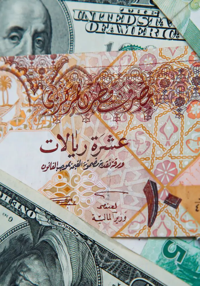 Qatari Riyals and US Dollars.