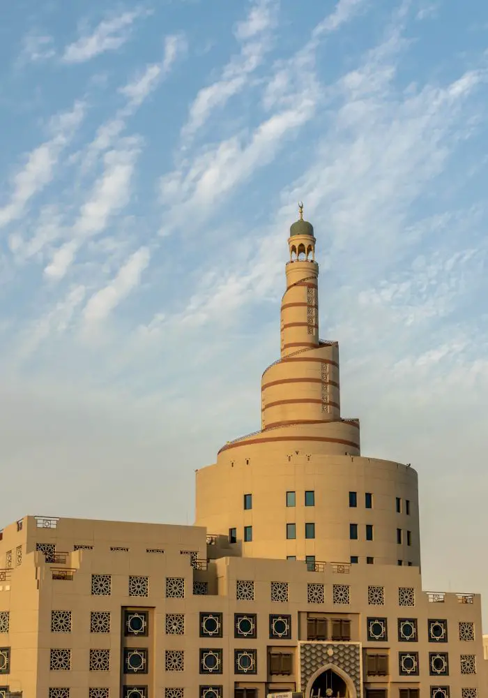 The twisting towers of the Islamic Cultural Center, a great addition to your One Day in Doha Itinerary.