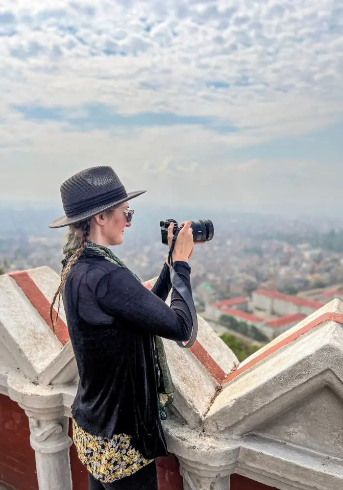 Monica above the city, taking photos of Kathmandu while Visiting Nepal.