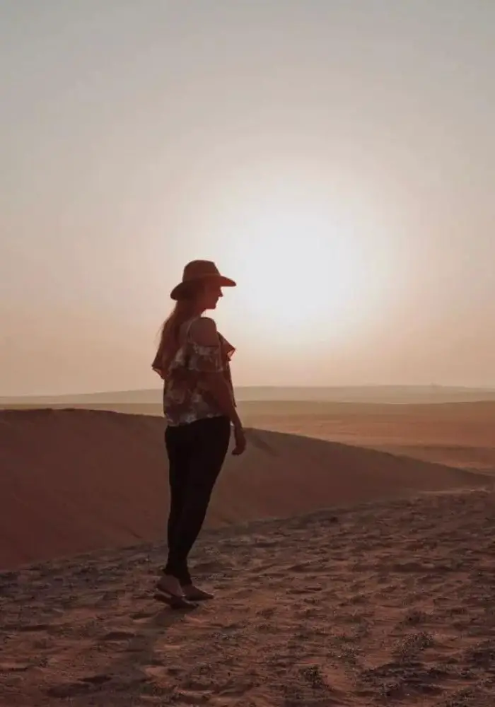 Monica at sunrise on A Liwa Desert Safari.