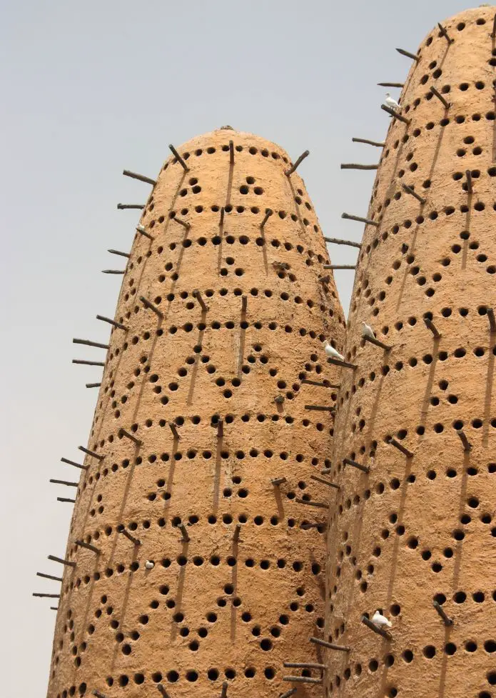 The intricate designs on the Pigeon Towers, one of the best places to see on a Doha stopover or Doha layover.