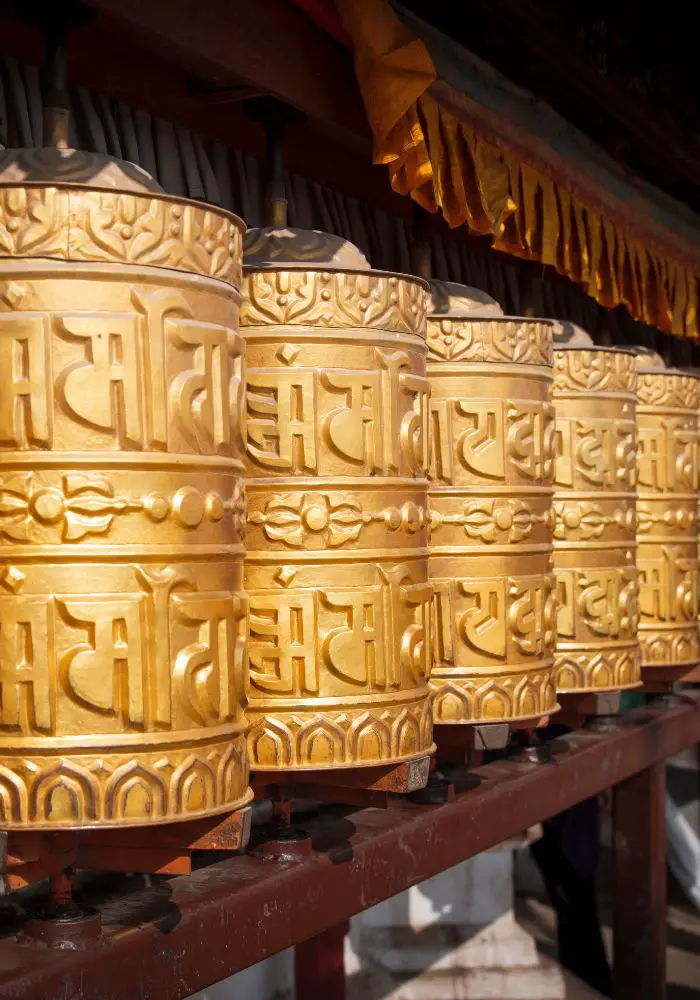 Golden prayer wheels at the temples in Kathmandu - Is Nepal Safe for Solo Female Travel?