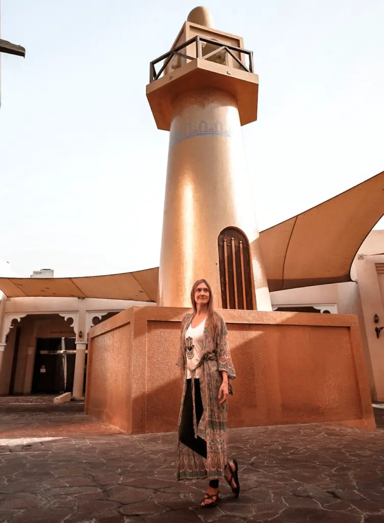 Monica in front of the Gold Masjid, one of the best Things To Do in Katara Cultural Village in Doha.