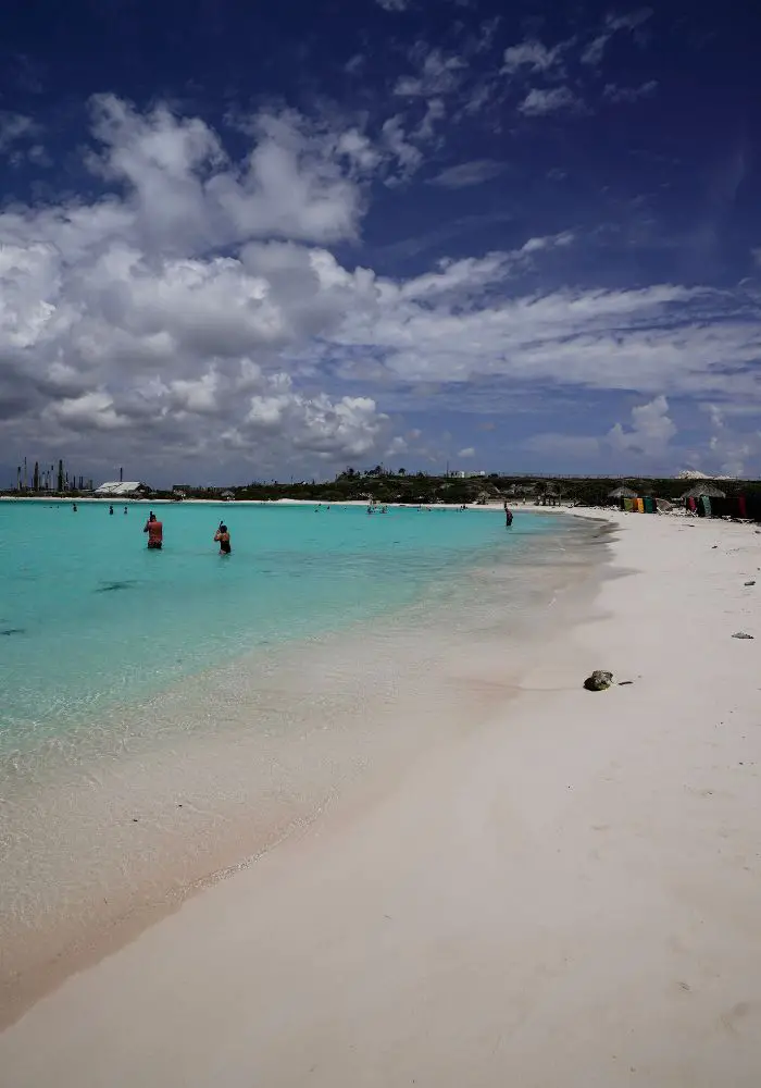 The white sand and turquoise water of Baby Beach in Aruba, where you will never see sharks.