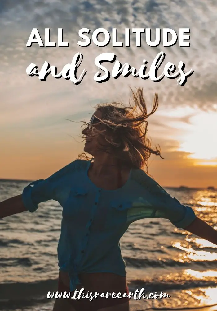 Girl smiling at the beach, Being Alone Captions and Quotes for Instagram.