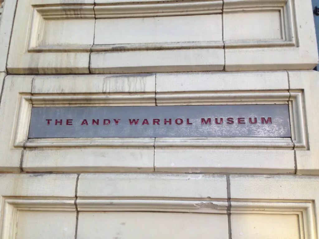 An outdoor plaque for the Any Warhol Museum, one of the best places to visit in Pittsburgh, PA.