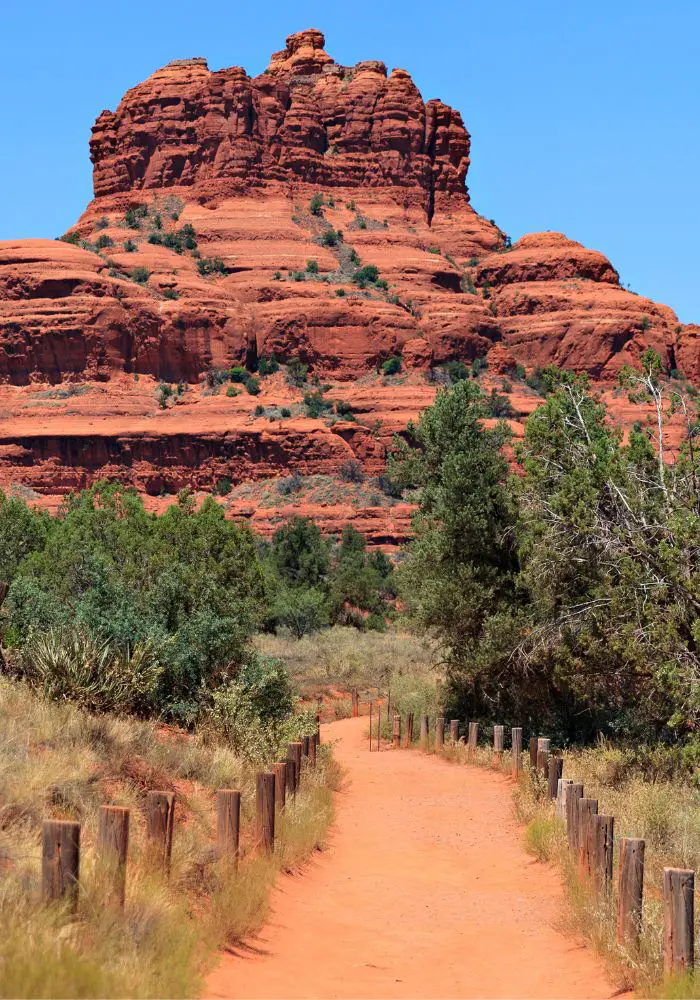 An easy Sedona hiking trail leading to red layered rocks.