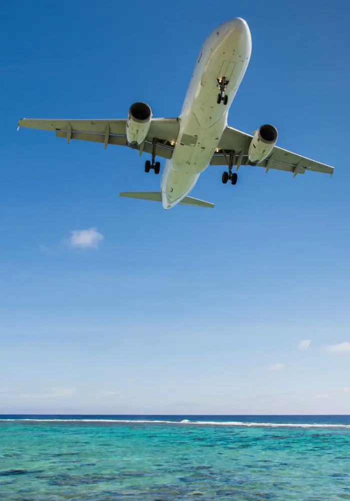 A large airplane flying into Rarotonga.