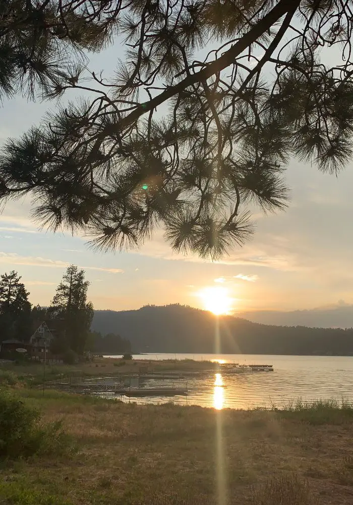 A bright sunset over Big Bear Lake, one of the best day trips from Palm Springs.