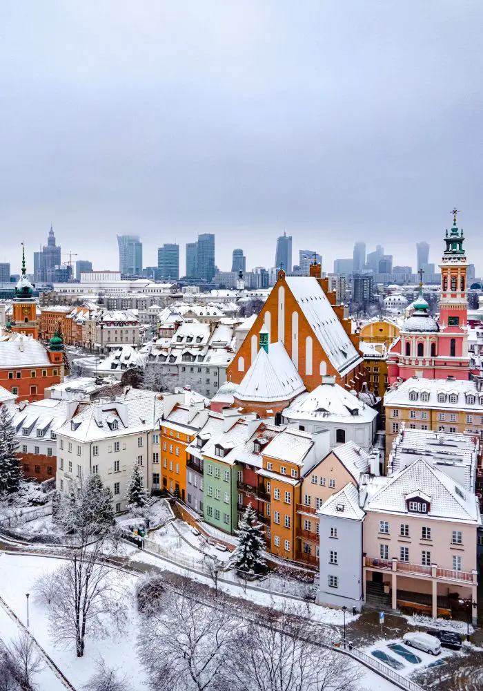 Colorful old Town architecture covered in snow in Warsaw.