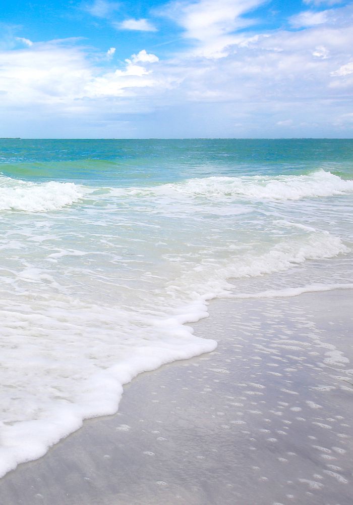 The white surf of Anna Maria Island, one of the best Florida islands.