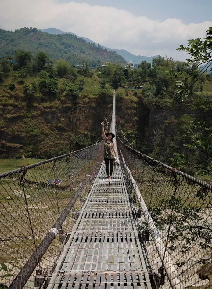 Monica in Nepal on a suspension bridge.