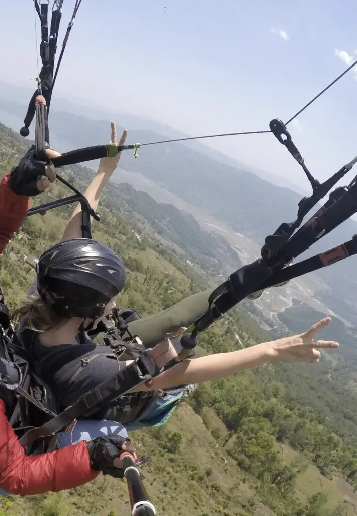 Monica and Deepak paragliding in Pokhara, Nepal.