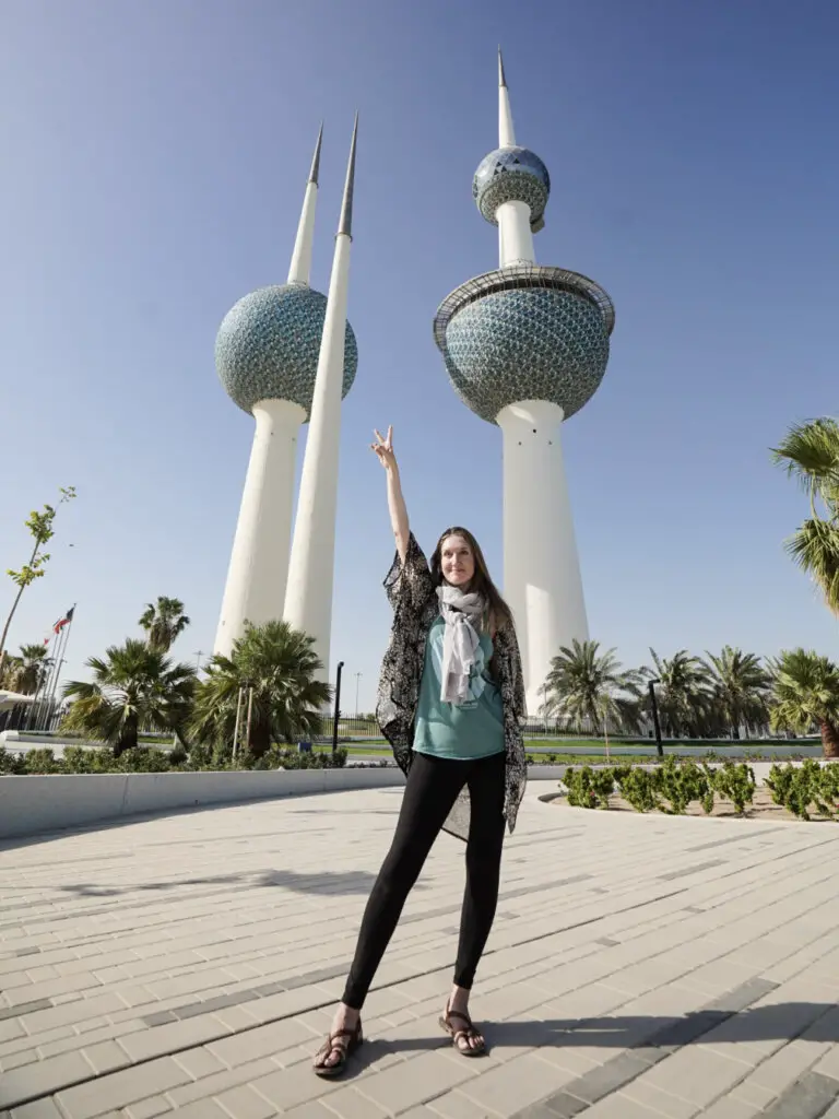 Girl in front of the Kuwait towers, traveling alone.