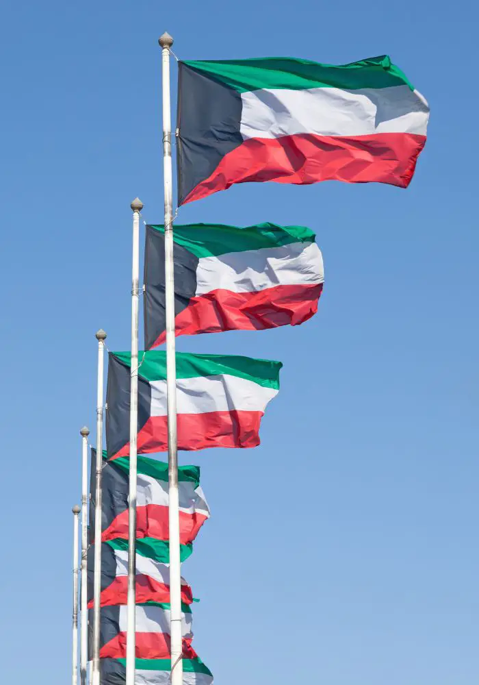 Kuwait flags blowing in the wind in Kuwait City in the Arabian Gulf.