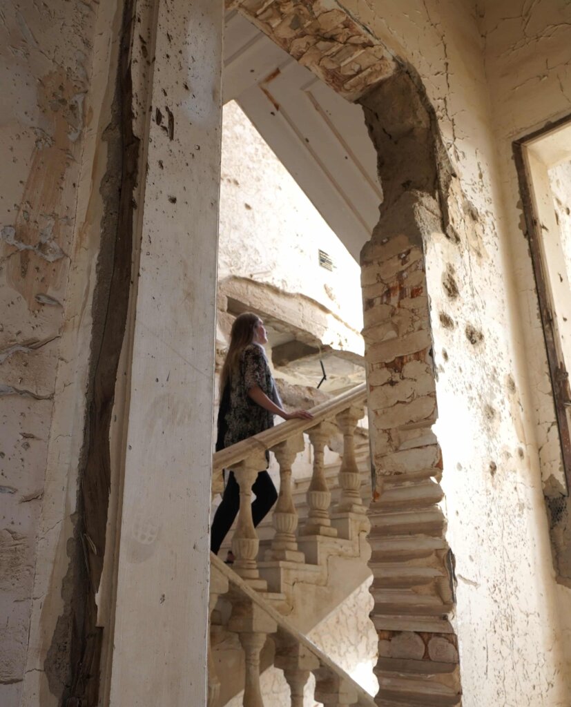 Girl exploring the Martyr's Museum, a deeply important place to visit in Kuwait.