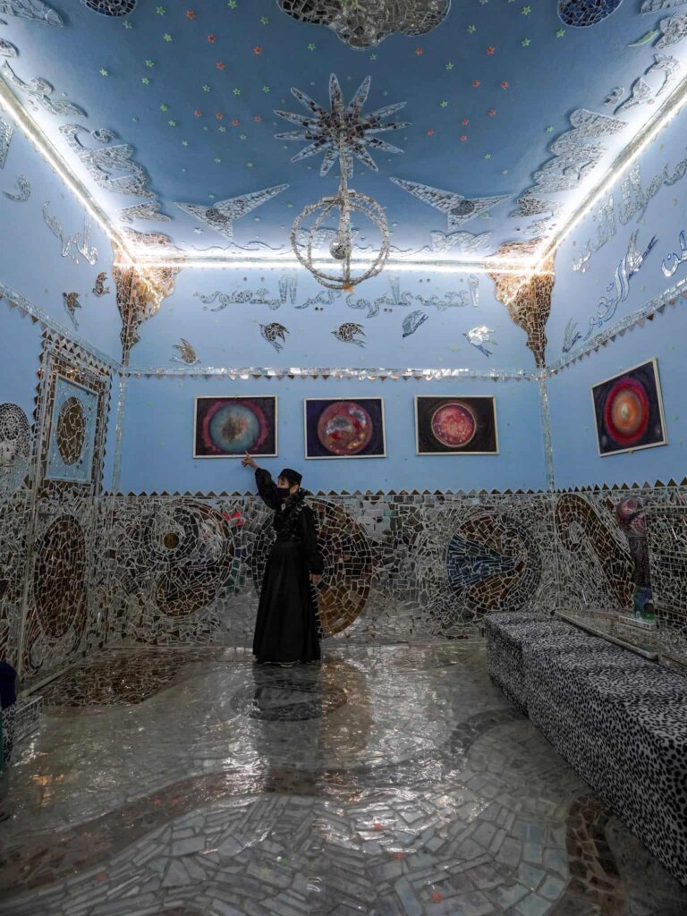 The artist leading a tour inside of the Mirror   House, one of the best places to visit in Kuwait.