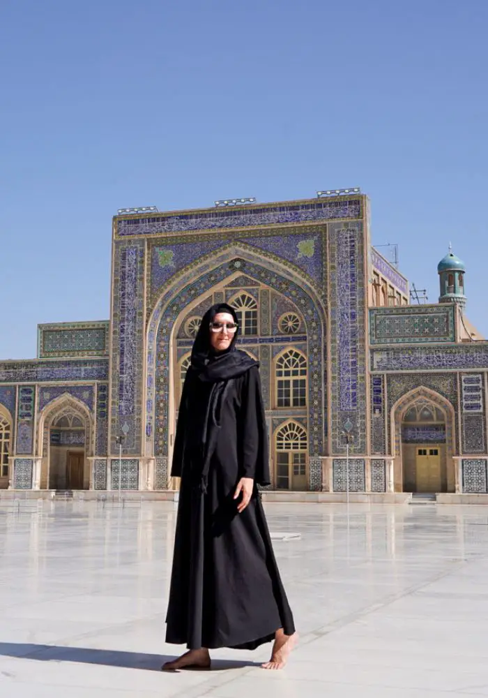 Monica wearing a long black abaya, traveling in Afghanistan as a woman.