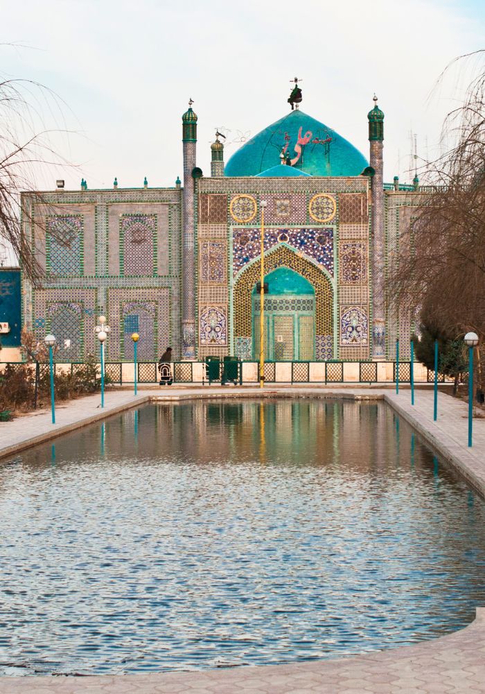 The ornate architecture of the Blue Mosque in Mazar-i-Sharif, one of the best places to see in Afghanistan.