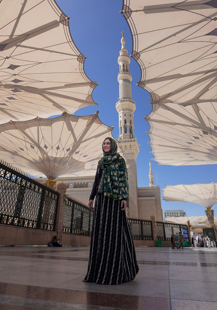 Monica showcasing what to wear in Saudi Arabia when in conservative areas like Medina - a long skirt, long sleeves, and headscarf.